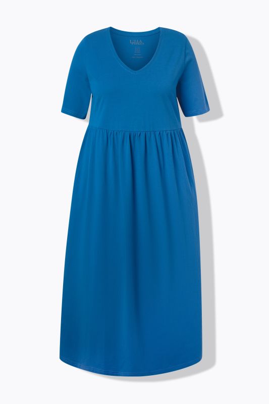 Robe maxi, coupe évasée. Décolleté V, manches courtes. Poches