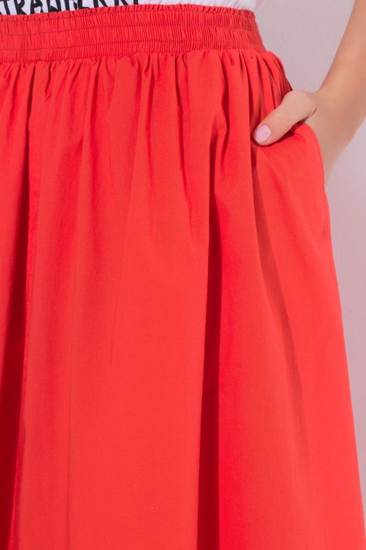 Jupe midi, matière stretch et taille élastique, coupe évasée