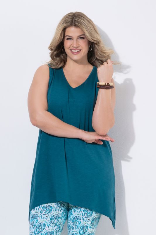 Débardeur long avec base en pointe des deux côtés. Décolleté en V. Coton bio. Coupe évasée