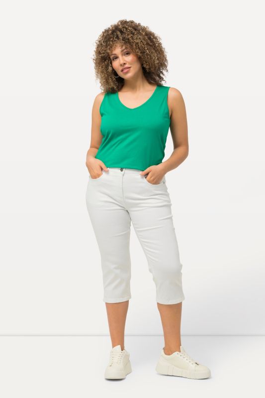 Jean corsaire Sarah. Coupe 5 poches ajustée, avec bas de jambe fendu