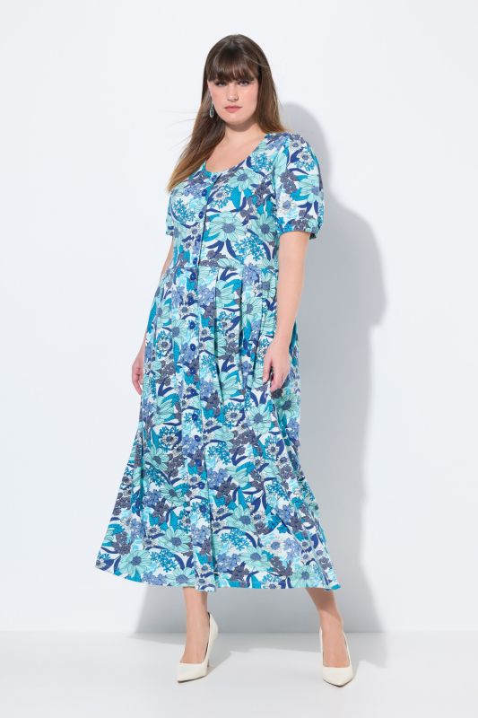 Robe maxi oversize en jersey. Décolleté rond et manches courtes. Imprimé à fleurs