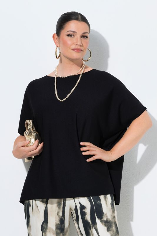 Pull oversize. Encolure bateau et manches chauve-souris