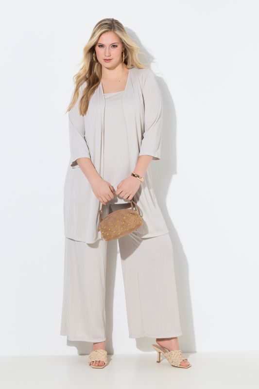 Gilet long en jersey côtelé. Coupe ouverte et encolure en V