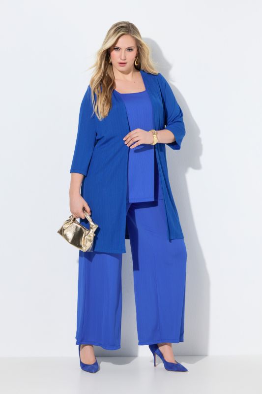 Gilet long en jersey côtelé. Coupe ouverte et encolure en V