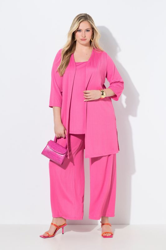 Gilet long en jersey côtelé. Coupe ouverte et encolure en V