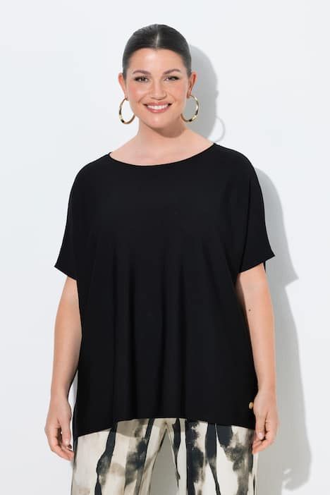 Pull oversize. Encolure bateau et manches chauve-souris