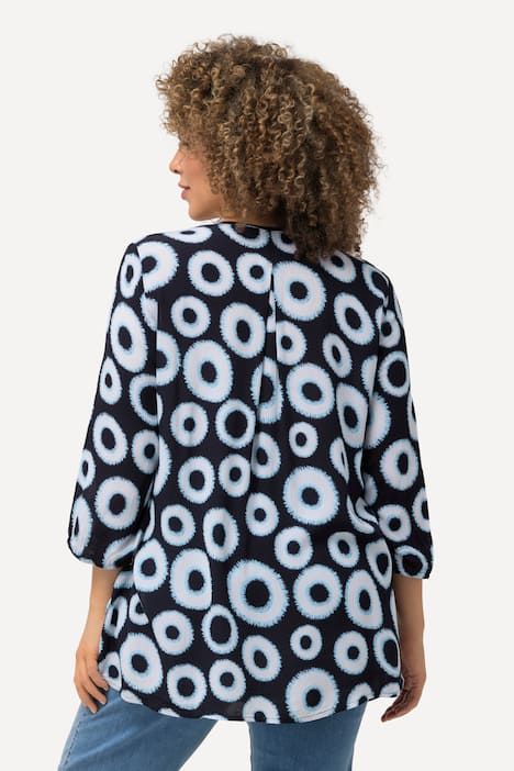Blouse smockée à motif cercles. Col rond et manches 3/4. Coupe évasée