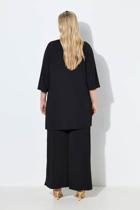 Gilet long en jersey côtelé. Coupe ouverte et encolure en V