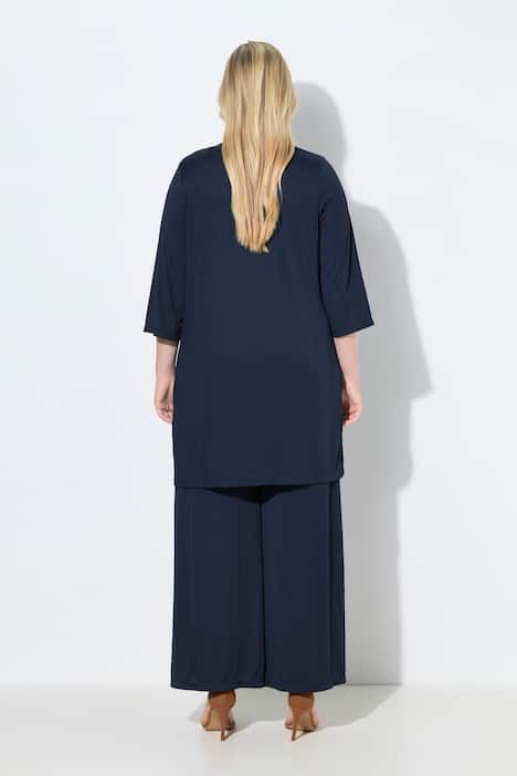 Gilet long en jersey côtelé. Coupe ouverte et encolure en V