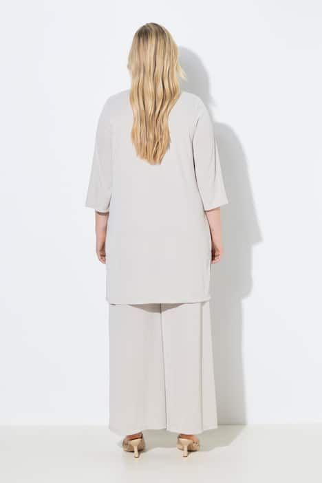 Gilet long en jersey côtelé. Coupe ouverte et encolure en V