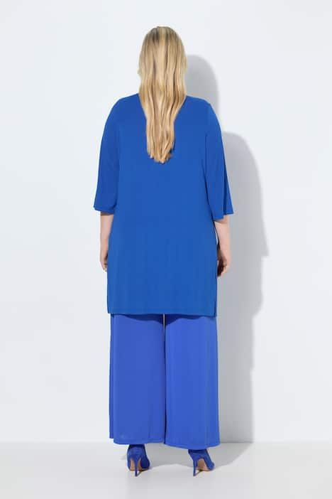 Gilet long en jersey côtelé. Coupe ouverte et encolure en V