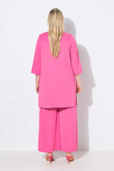 Gilet long en jersey côtelé. Coupe ouverte et encolure en V