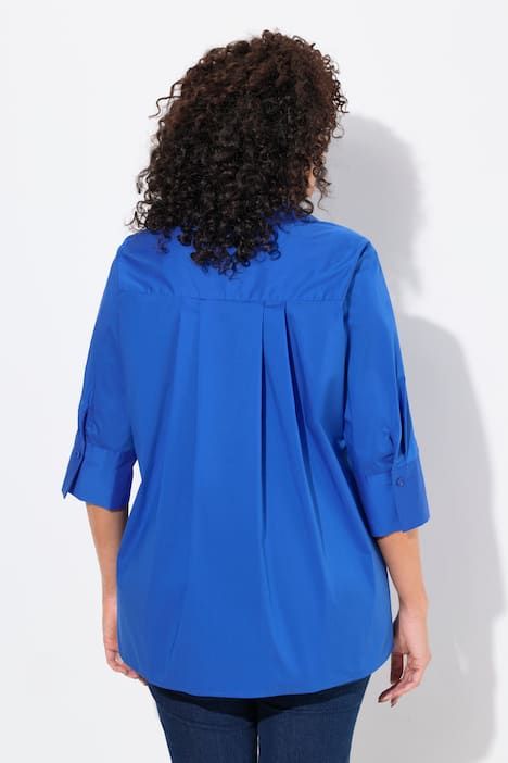 Chemisier à pli d'aisance. Manches 3/4 et col classique. Coupe évasée