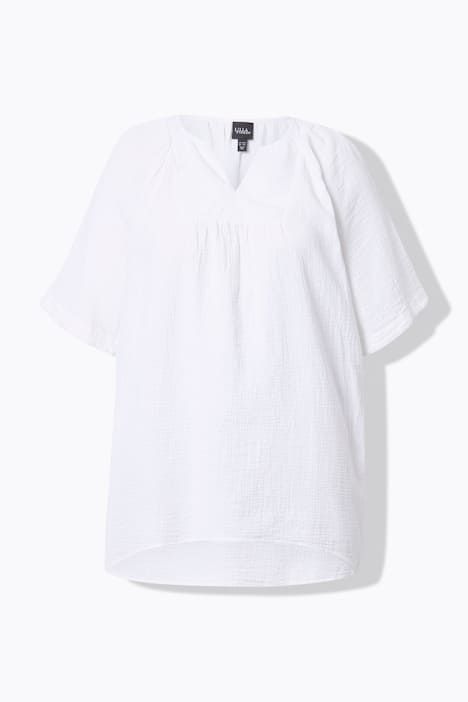 Blouse en mousseline. Col tunisien et manches courtes. Coupe évasée