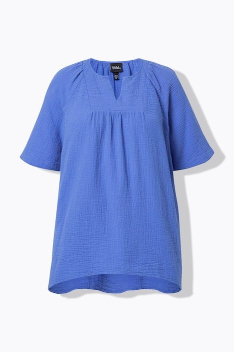 Blouse en mousseline. Col tunisien et manches courtes. Coupe évasée