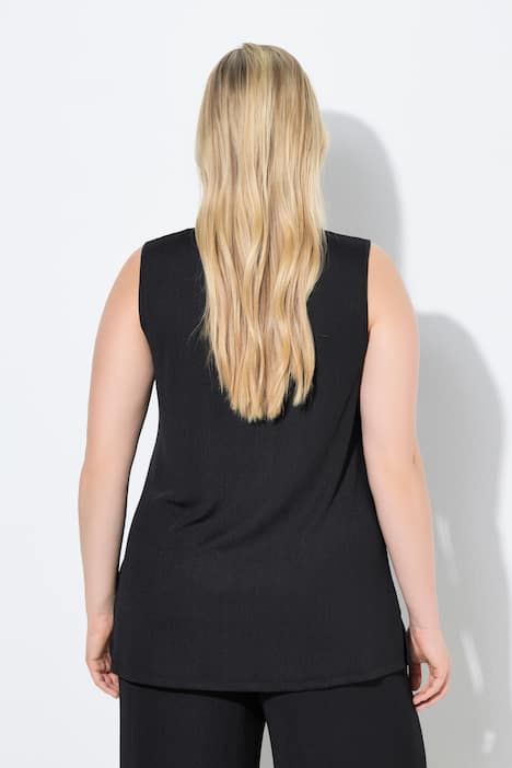 Débardeur côtelé. Décolleté carré. Bretelles larges. Coupe évasée