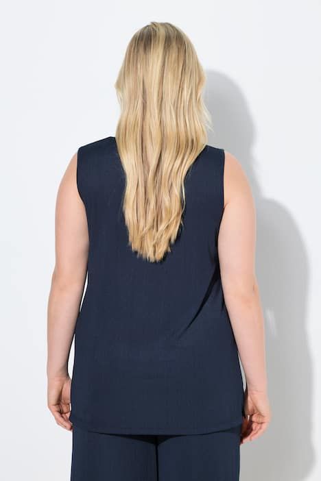 Débardeur côtelé. Décolleté carré. Bretelles larges. Coupe évasée