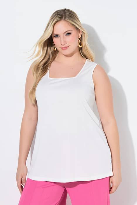 Débardeur côtelé. Décolleté carré. Bretelles larges. Coupe évasée