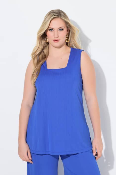 Débardeur côtelé. Décolleté carré. Bretelles larges. Coupe évasée