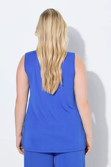 Débardeur côtelé. Décolleté carré. Bretelles larges. Coupe évasée