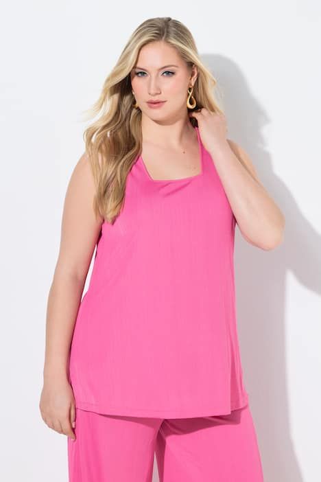 Débardeur côtelé. Décolleté carré. Bretelles larges. Coupe évasée