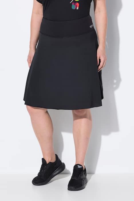 Jupe-short avec legging intégré. Taille élastique. Poches pour smartphone