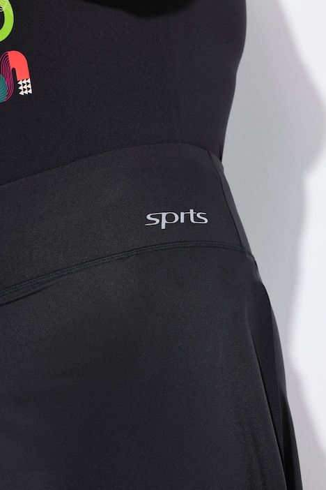 Jupe-short avec legging intégré. Taille élastique. Poches pour smartphone