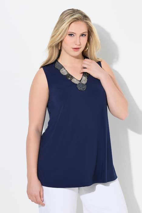 Débardeur à broderies perles. Décolleté V. Coupe évasée