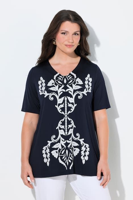 T-shirt avec imprimé, au tombé fluide, décolleté en V et manches courtes, coupe évasée