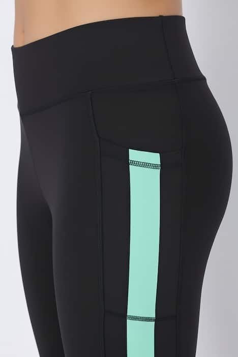 Legging technique taille haute, bande colorée sur la jambe, matière recyclée