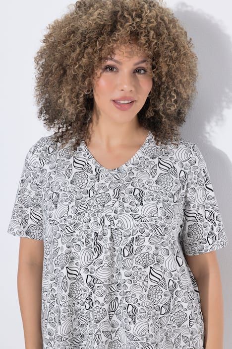 T-shirt à fleurs, base en pointe, décolleté en V et manches courtes