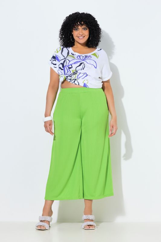 Jupe-culotte en tissu texturé. Taille élastique. Jambe droite, longueur mollet