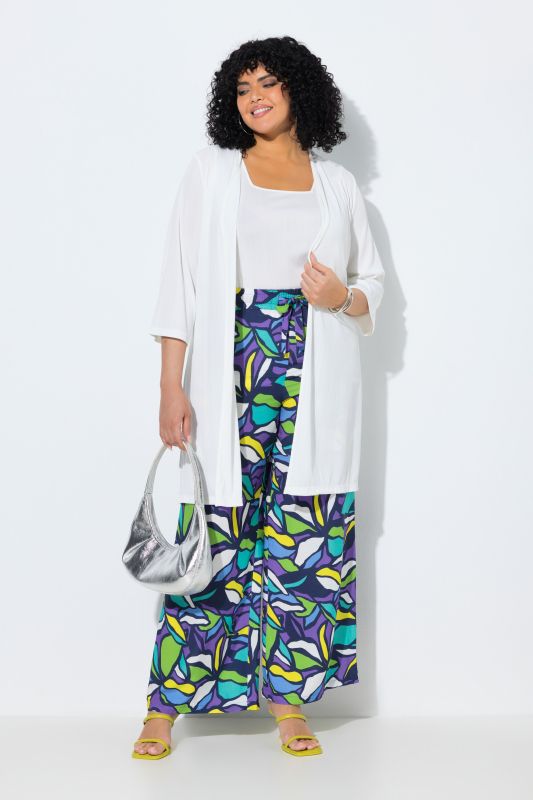 Gilet long en jersey côtelé. Coupe ouverte et encolure en V