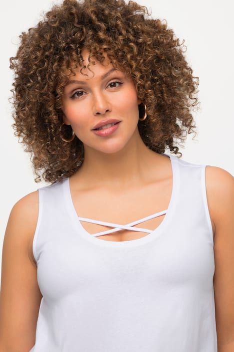 Débardeur long, coupe évasée. Décolleté rond à rubans fantaisie. Bretelles larges