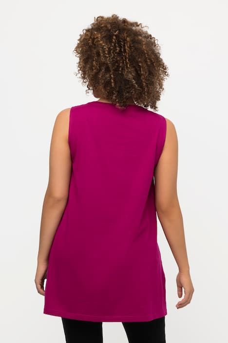 Débardeur long, coupe évasée. Décolleté rond à rubans fantaisie. Bretelles larges