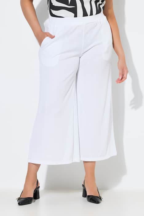 Jupe-culotte en tissu texturé. Taille élastique. Jambe droite, longueur mollet