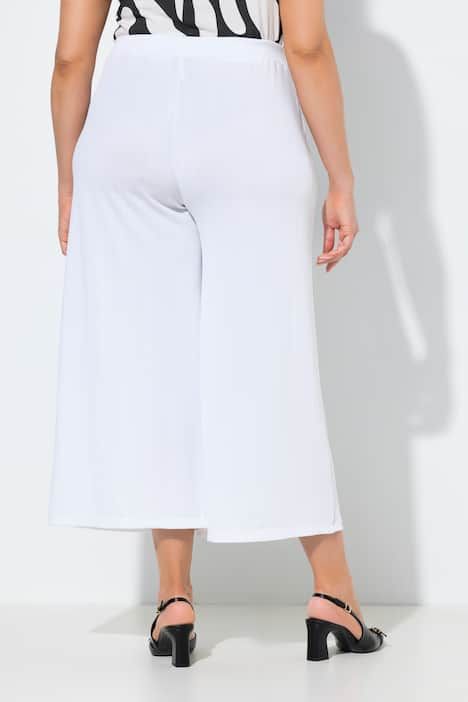 Jupe-culotte en tissu texturé. Taille élastique. Jambe droite, longueur mollet