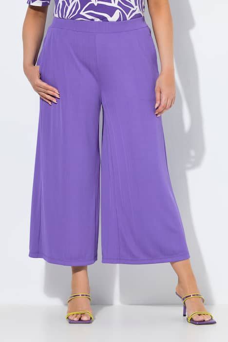 Jupe-culotte en tissu texturé. Taille élastique. Jambe droite, longueur mollet