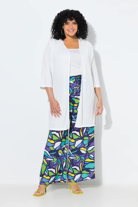 Gilet long en jersey côtelé. Coupe ouverte et encolure en V