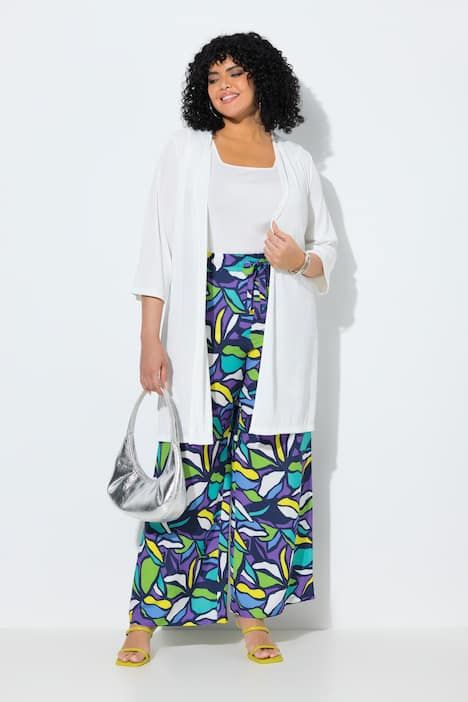 Gilet long en jersey côtelé. Coupe ouverte et encolure en V