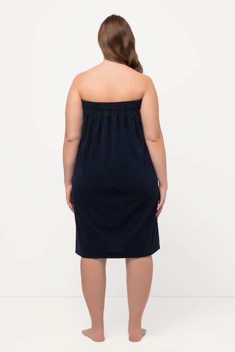 Robe sortie de bain en éponge. Fermeture velcro. Bande élastique dans le dos