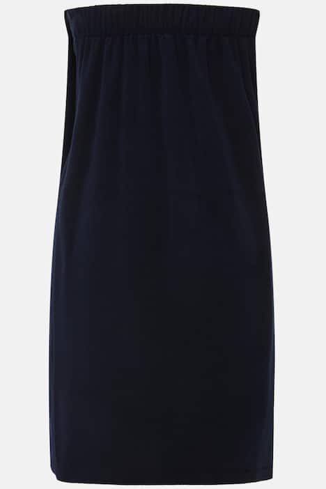 Robe sortie de bain en éponge. Fermeture velcro. Bande élastique dans le dos