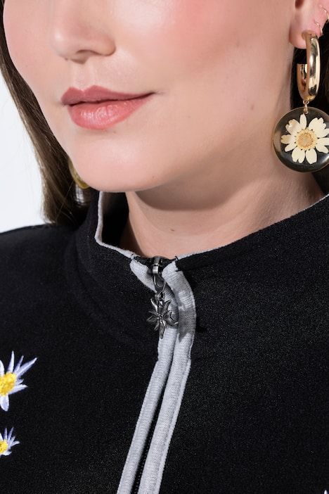 Veste en polaire esprit costume traditionnel bavarois. Fermeture zippée à double sens. Broderies edelweiss