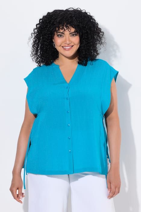 Blouse oversize, col tunisien et manches courtes, cordons pour ajuster la silhouette