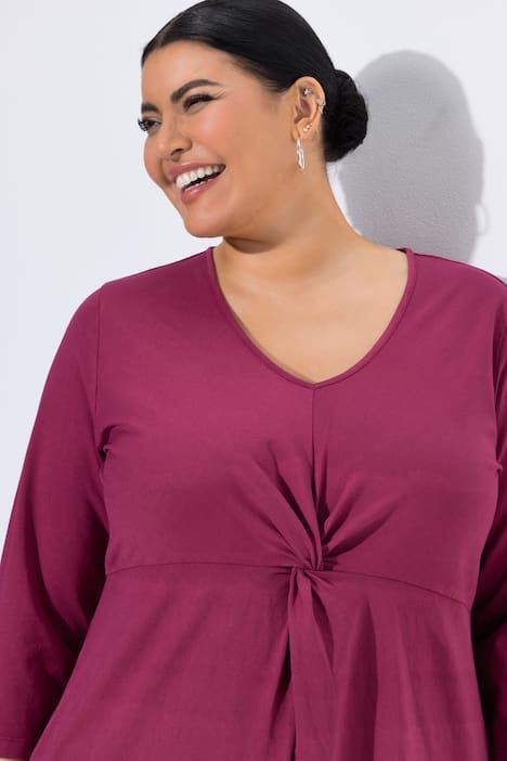 Robe en jersey motif batik, décolleté en V et manches 3/4, coupe évasée