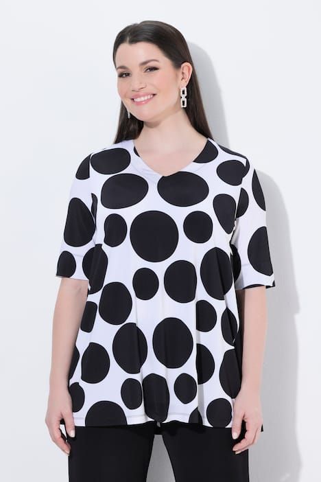 T-shirt au tombé fluide, motif à pois, décolleté en V et manches courtes, coupe évasée