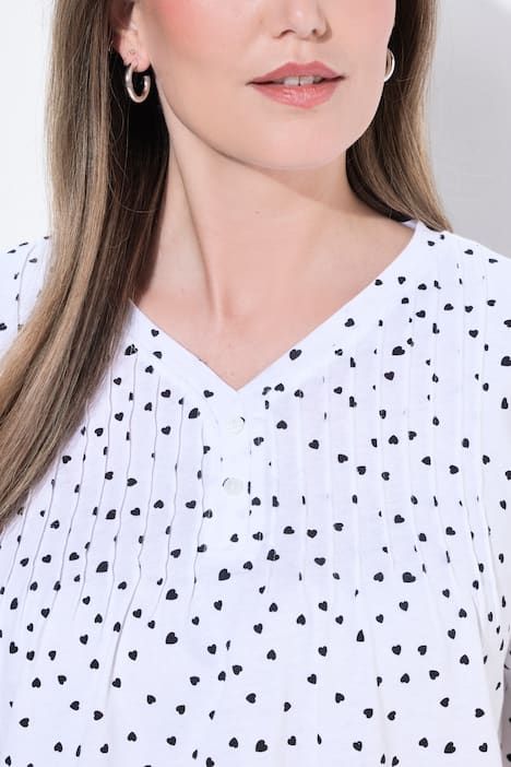 T-shirt avec passepoils, décolleté en V et manches courtes, coupe évasée