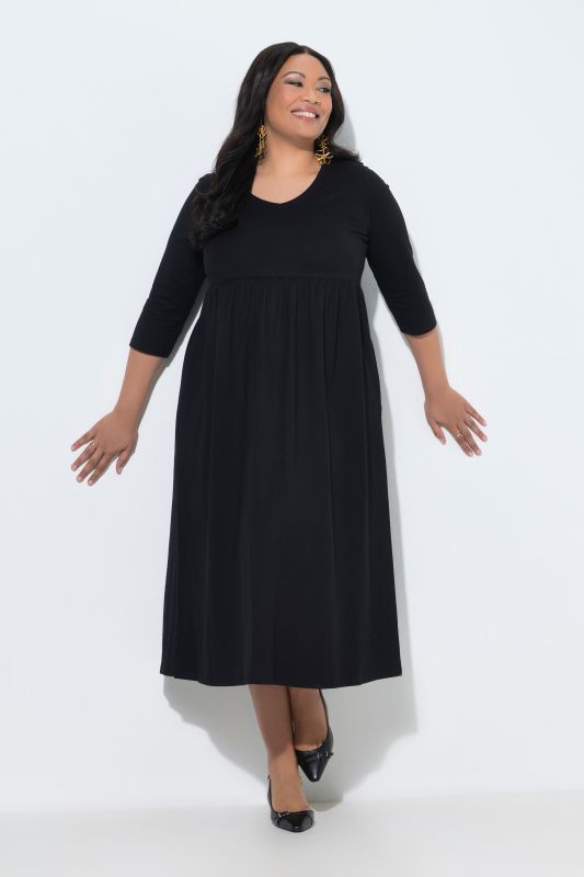 Robe en jersey avec poches, couture empire, décolleté en V et manches 3/4