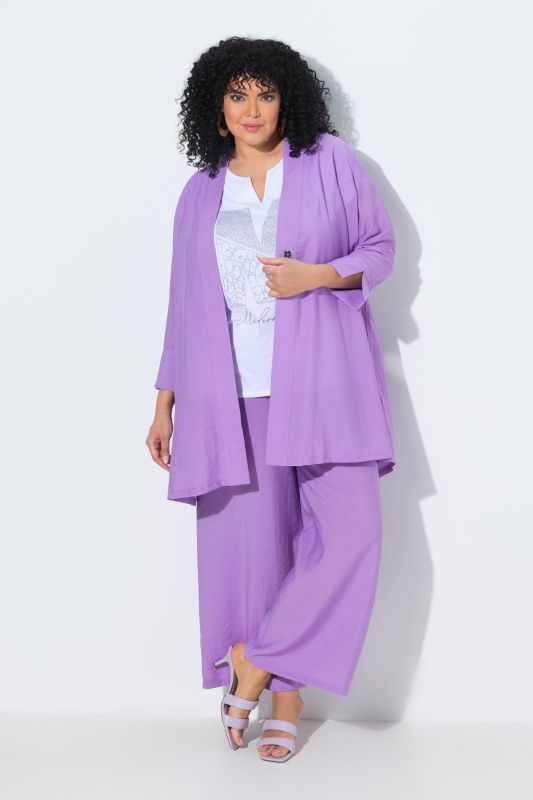 Veste à bouton-pression. Décolleté V et manches 7/8