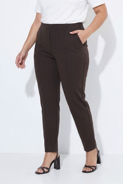 Pantalon point de Rome, jambe carotte. Taille élastique, plis fantaisie